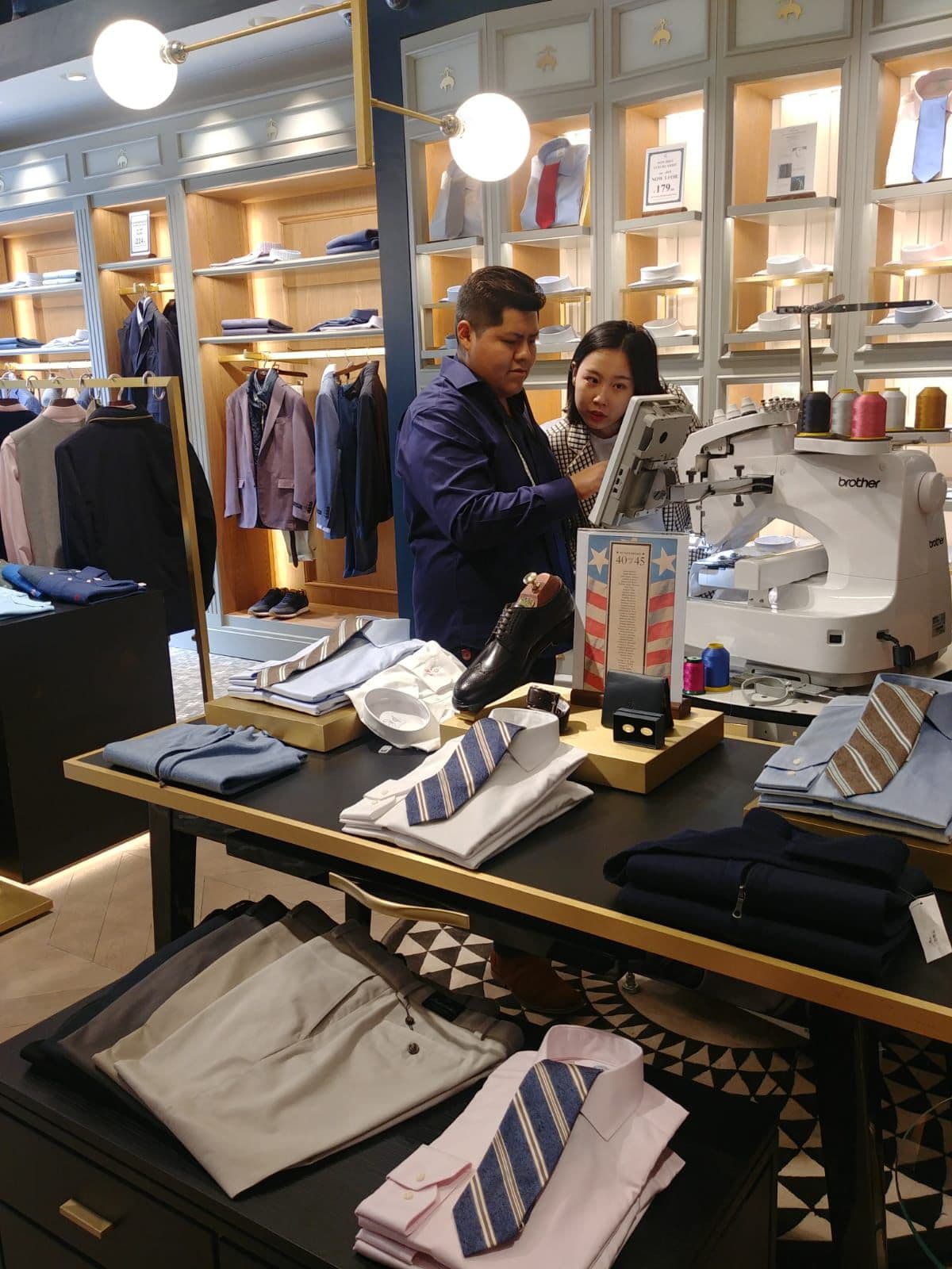 Coco Gift Shop Owners with Embroidery Machine